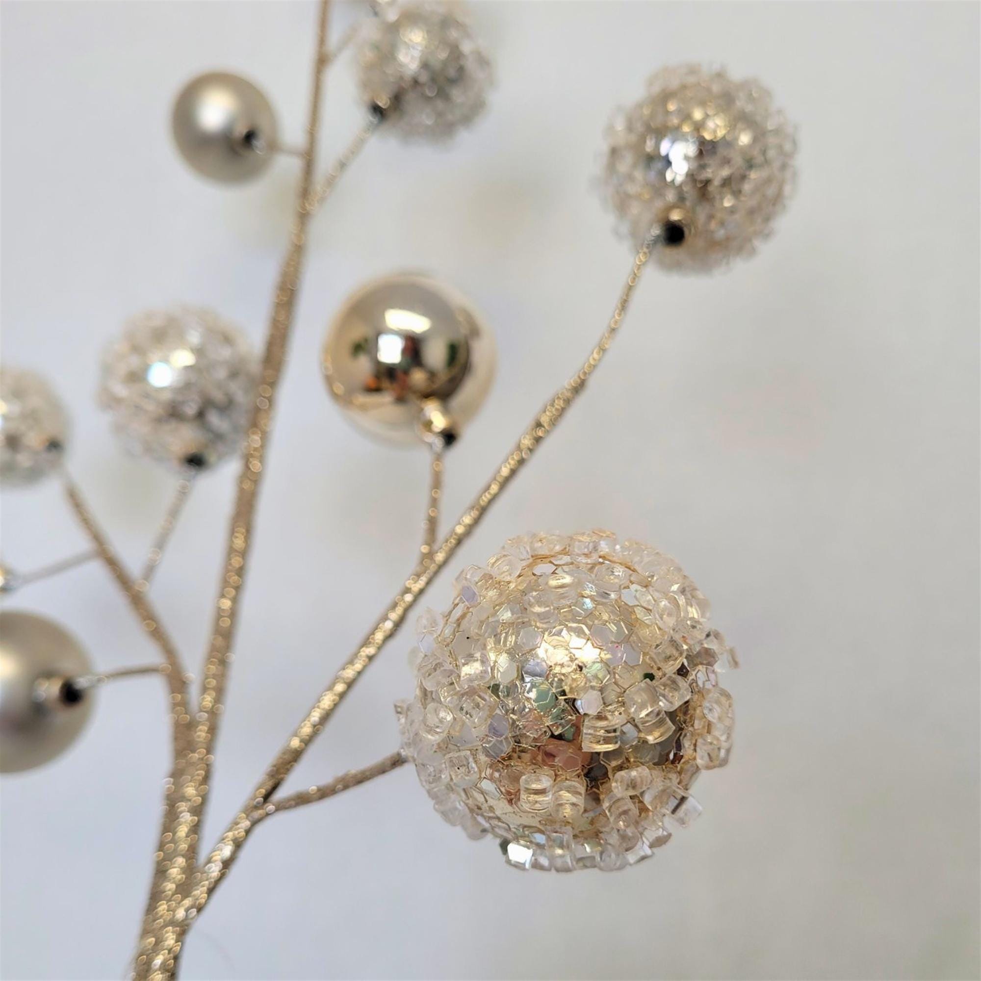 27-inch champagne Christmas spray featuring glittered iced ornament balls with matte and shiny champagne ornaments on wired branches, perfect for luxury Christmas trees, wreaths, and holiday decorating.